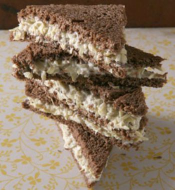 Artichoke Tea Sandwich wedges stacked on top of each other in a tower