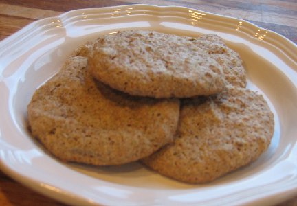 4 flourless pistachio cookies on a plate