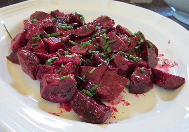 large pile of Roasted Beets with Horseradish Vinaigrette on a large white plate