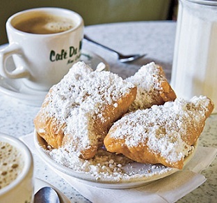 place setting with Cafe Monde Beignets and tea