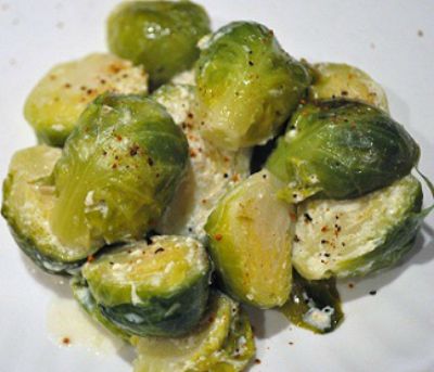 close up image of Creamy Brussels Sprouts with Lemon on a white plate