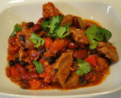 Clod Tenders with bell peppers and beans in a white bowl