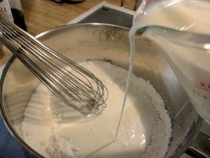 Adding milk to cornstarch mixture