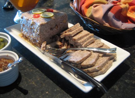 Country Pate on a serving tray sliced up and ready to be eaten