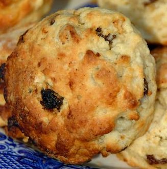 close up image of a Date Drop Scone from dates recipe collection on a blue plate