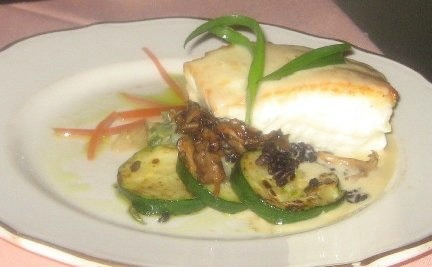 Halibut with Lemon-Basil Vinaigrette from whitefish recipe collection artfully plated on a white dish