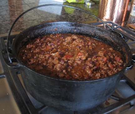 Linda's Chili Con Carne cooking in a large dutch oven