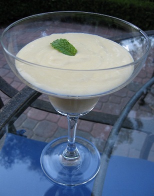 Mango Zabaglione served in cocktail glass with mint leaf as garnish