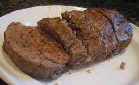 Garden Meatloaf sliced up and on a white plate