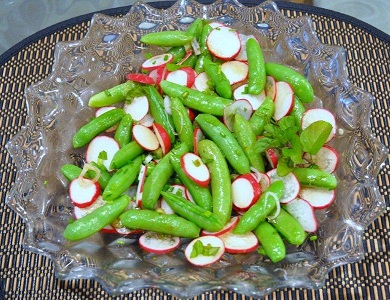 pea radish salad from the pea recipe collection in a large decorative glass bowl