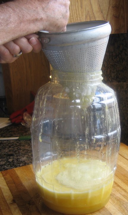 Straining the pulp from the liquid to make agua fresca