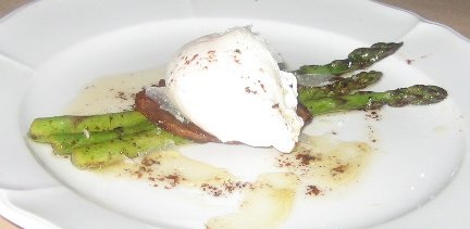 Asparagus with Poached Eggs and Shaved Parmesan on a plate