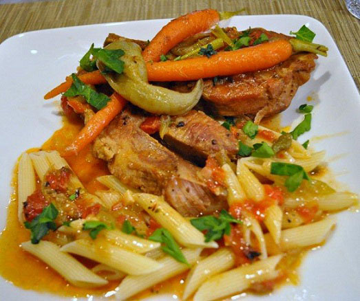 A savory plate of Braised Country-Style Pork Ribs and vegetables ready to be served for dinner.