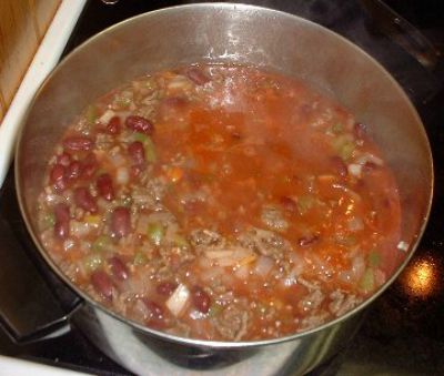 Chasen Famous Chili boiling in a tall stockpot
