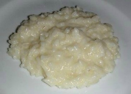 risotto served on a white dinner plate