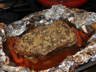 Wrapping foil tightly around the top of the pan for the first 15