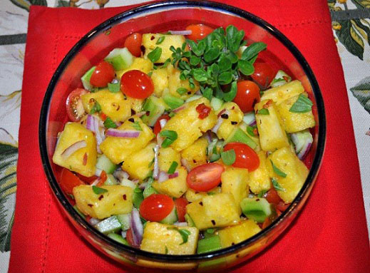Fruit and vegetable salad with Champagne vinaigrette in a large glass bowl 