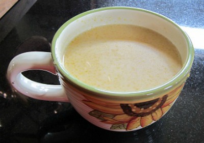 Mexican Atole in a large tea cup with sunflower motif on the side