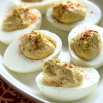 Perfect Deviled Eggs arranged on a white plate
