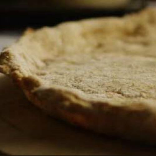 close up image of crispy whole wheat thin crust pizza dough 