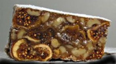 slice of fig and walnut panforte from the side