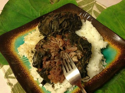 Hawaiian Lau Lau Pork on a bed of rice plated on a colorful square plate