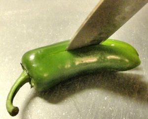 Cutting open chile pepper
