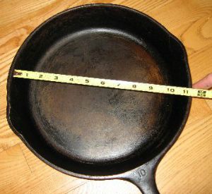 Measuring cast iron pan on top