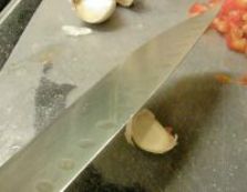 Crushing garlic clove