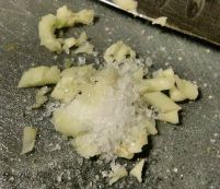 Crushing garlic with salt