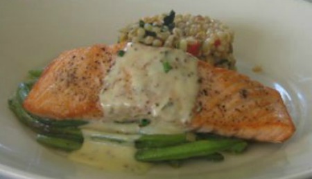 Baked Salmon with Dill Mustard Sauce served on a white plate