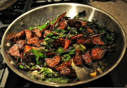 Roasted Beets with Sauteed Greens in a large stainless steel skillet