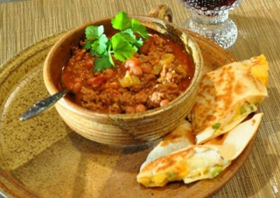 Spicy Chili in a bowl with Quesadila on the side