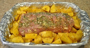 Pork roast and potatoes ready to bake