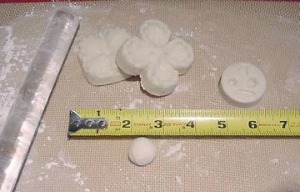making flowers for the dogwood cake, measuring icing pieces