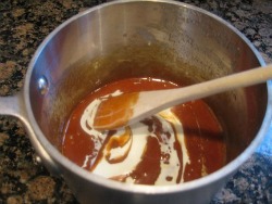 stirring in butter to caramel sauce