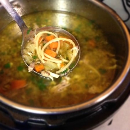 Chicken Noodle Soup ladled out of an instant pot