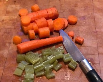 Jewish Chicken Soup-cutting up cooked carrots and celery